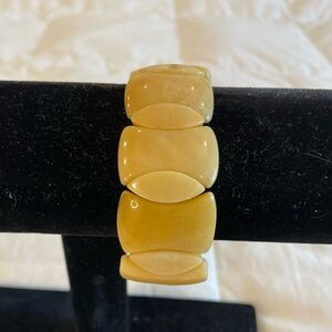 This is a Faux Baltic Amber Looking Bracelet.  EUC.